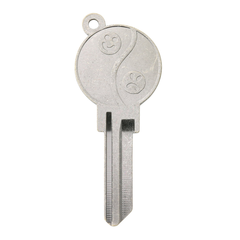 Metal key blade with Yin and Yang design on a white background