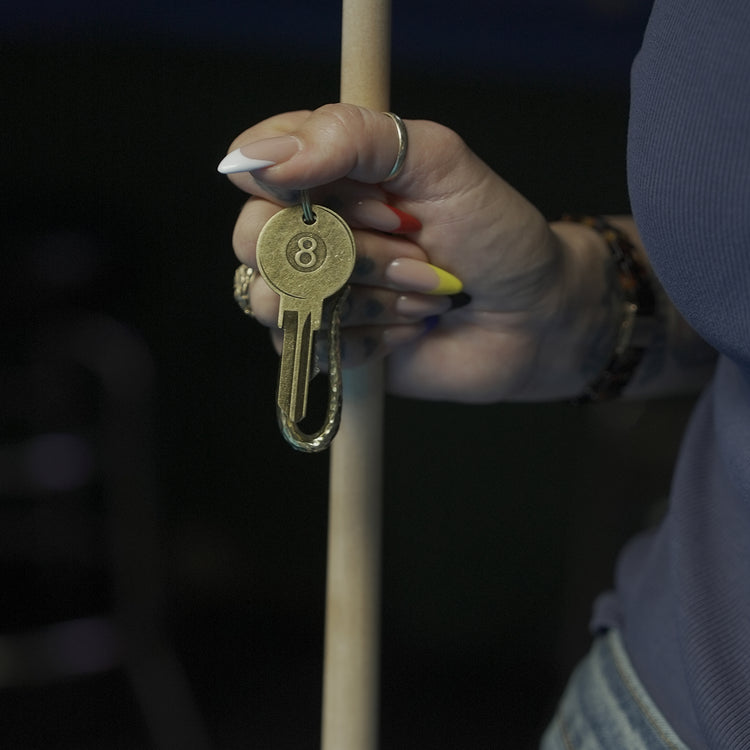 Eight Ball House Key in Hands