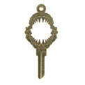 Gold key on white background with shark mouth design.