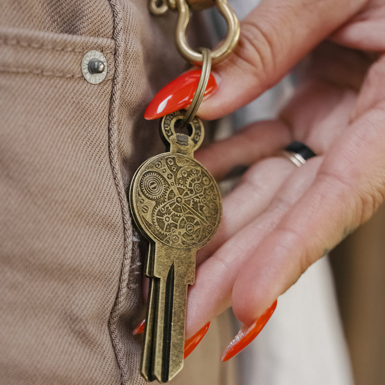 Clockwork Key on Keychain in Hand