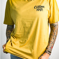 Tattooed woman wearing a yellow t-shirt with 'Custom Keys.com' text on a white background