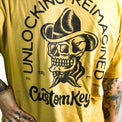 Tattooed woman wearing a yellow t-shirt with skull with cowboy hat and 'CustomKeys.com' text on a white background