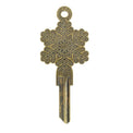 A bronze-colored key with a snowflake-shaped cut-out on the head.