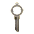 Brass key on white background with cannibal snake design.